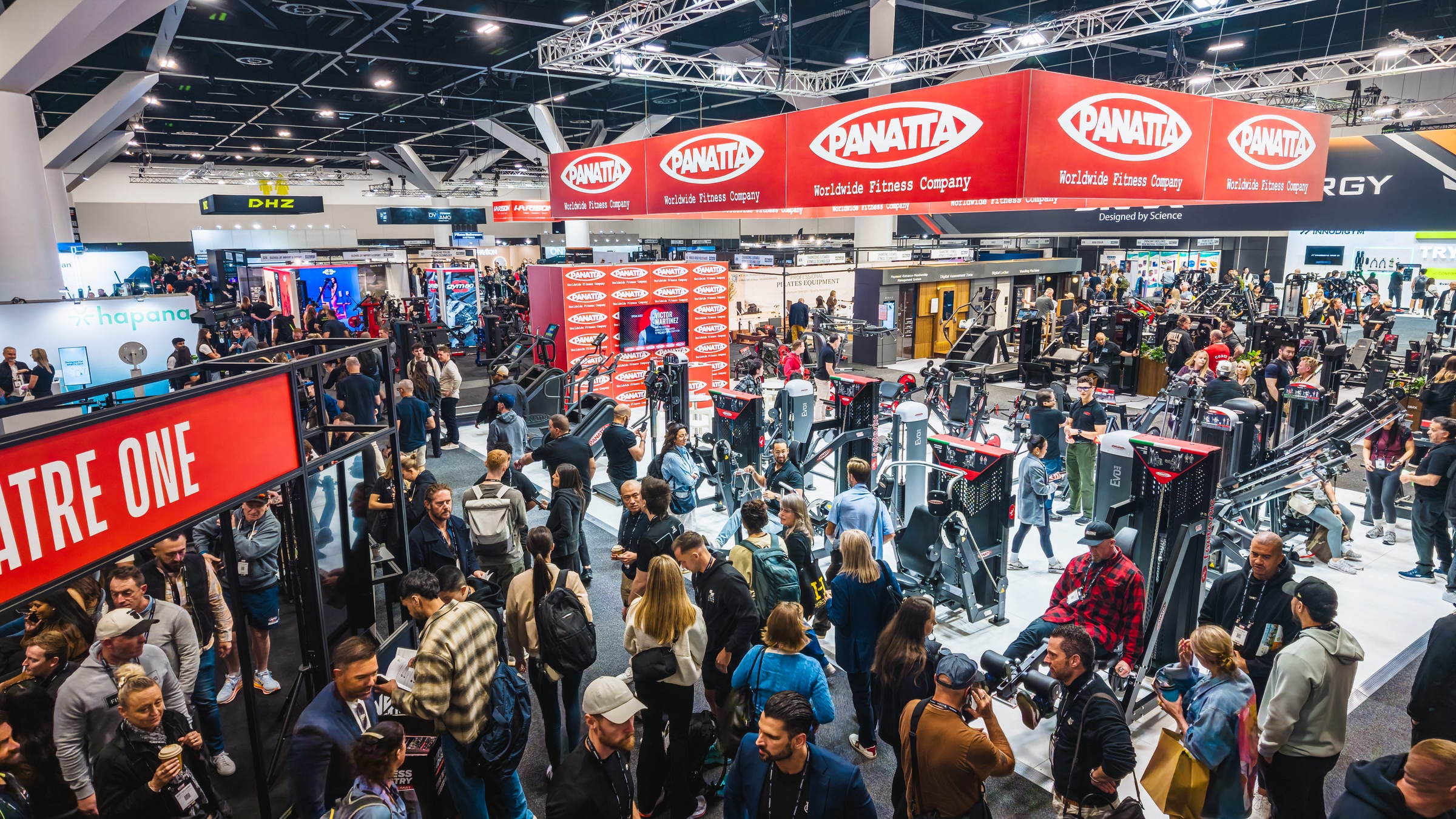 Aerial view of the busy AusFitness Expo show floor with brand stands and crowds at ICC Sydney